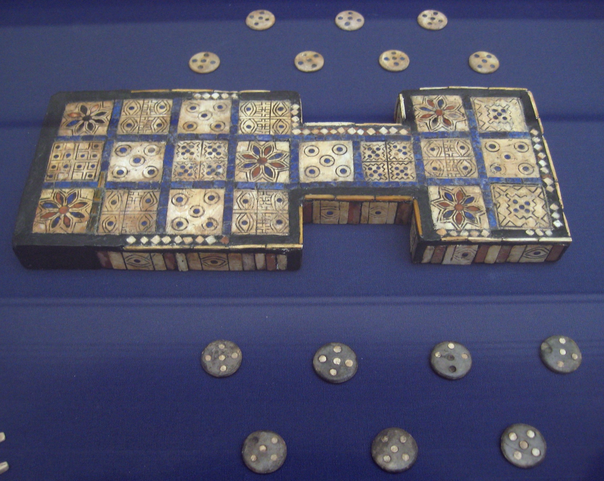 The Royal Game of Ur board with its counters, wood inlaid with shell and lapis